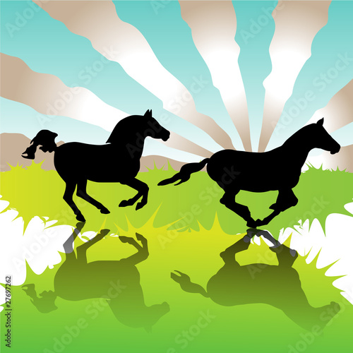 Galloping horses in field