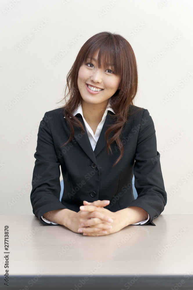 a portrait of young business woman on the desk a portrait of young business woman on the desk