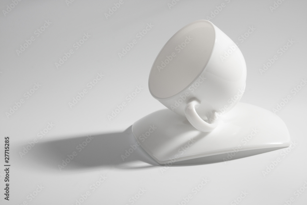 An empty coffee cup on a gray background An empty coffee cup on a gray background