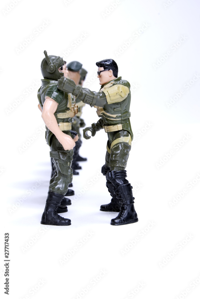 toy soldiers in camouflage   over white background