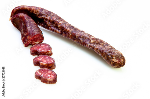 delicious fresh sausage sliced up on white background