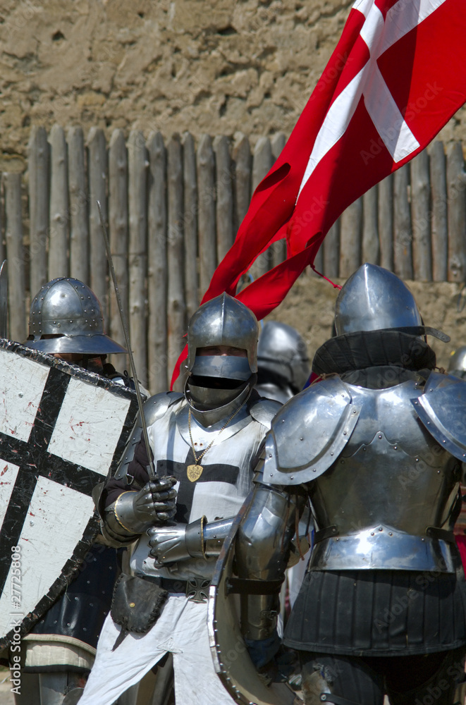 Fototapeta premium Medieval european knight near citadel wall