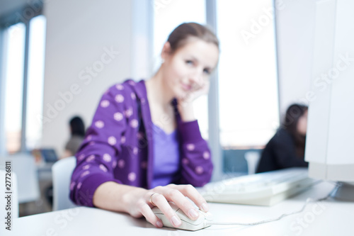 pretty young college student in a library  shallow DOF  color to