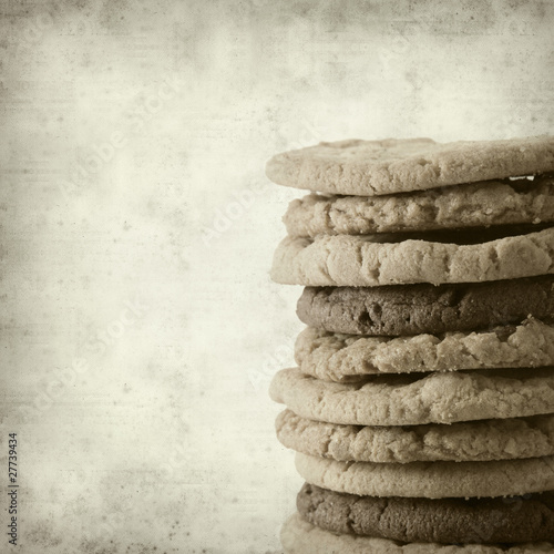 textured old paper background with sweet cookies photo