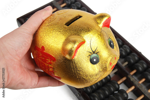 Piggy bank and chinese abacus photo