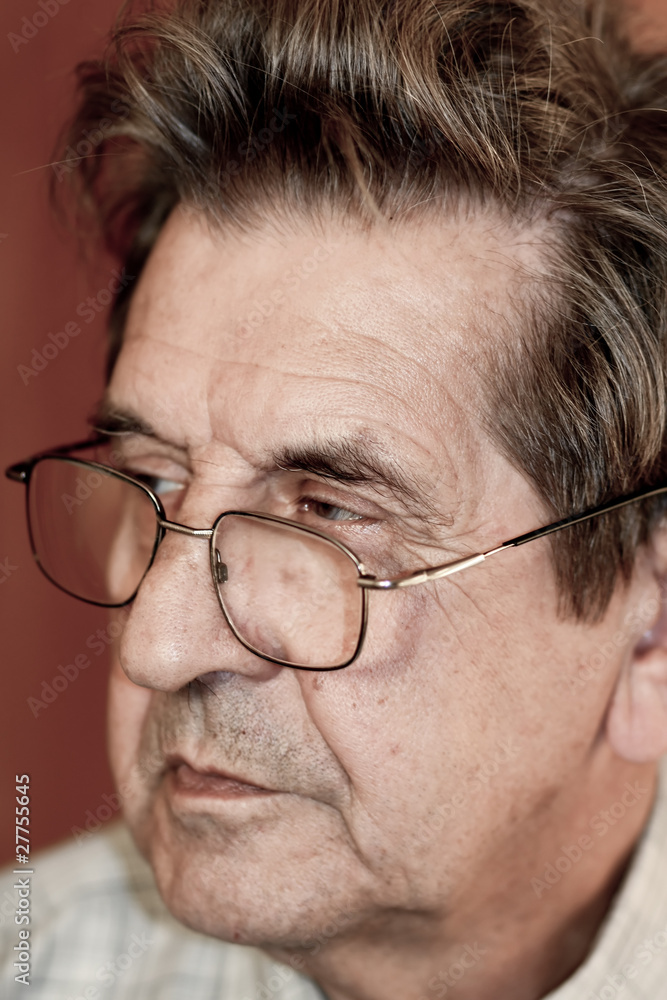 portrait of an elderly man looking seriously portrait of an elderly man looking seriously