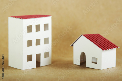 paper models of village and city dwelling houses with red roofs,