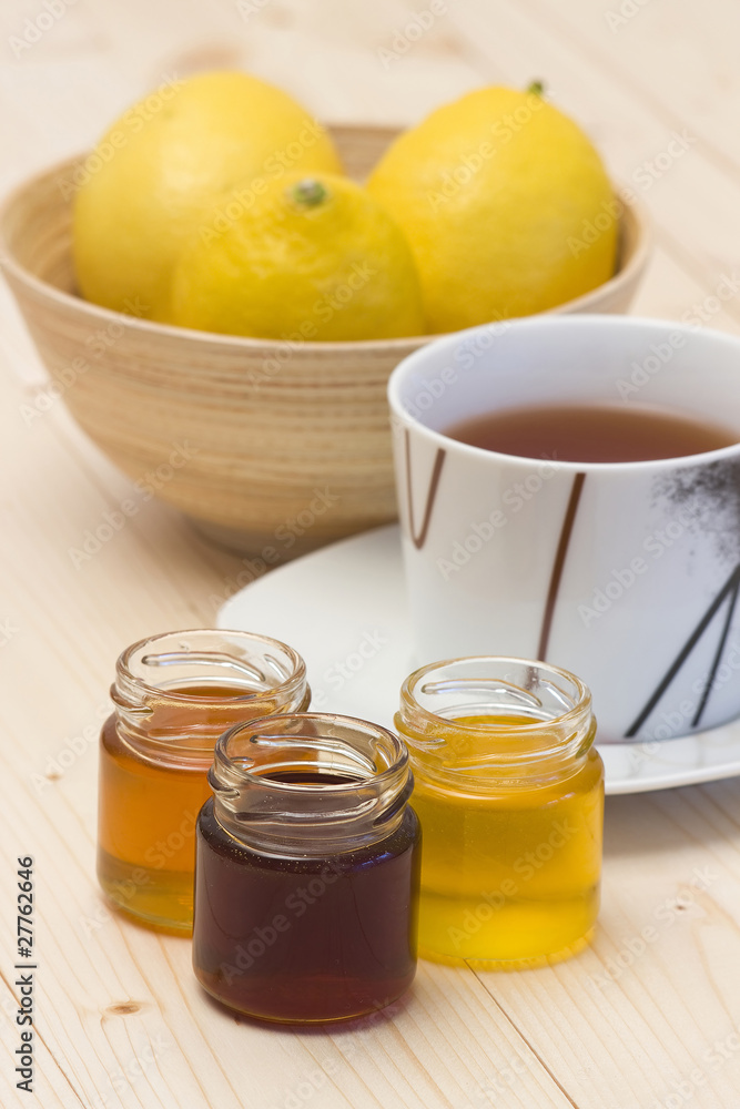 cup of lemon tea and honey cup of lemon tea and honey