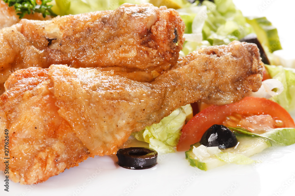 Roasted chicken legs with salad