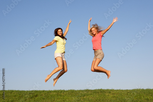 Young women jumping in air