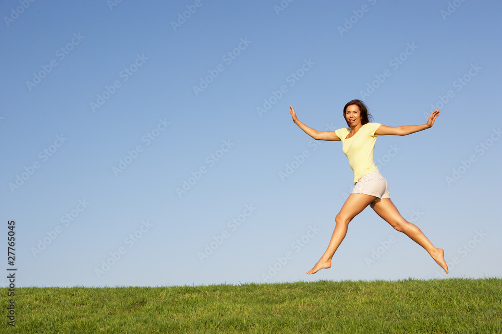 Young woman  jumping in air