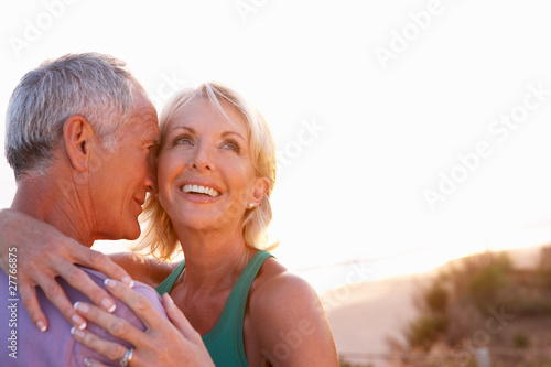 Romantic Senior Couple in love at sunset