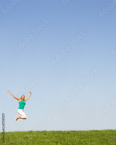 Senior woman jumping in air