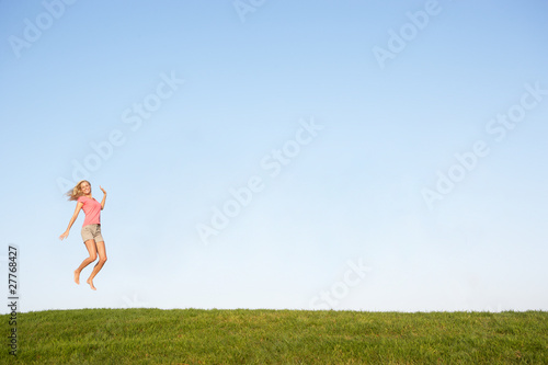Young woman jumping in air