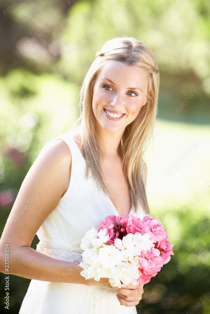 Bride Wearing Dress Holding Bouqet At Wedding Bride Wearing Dress Holding Bouqet At Wedding