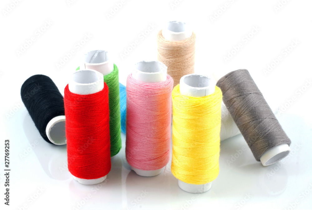 Set of colorful spools of thread isolated on white background Set of colorful spools of thread isolated on white background