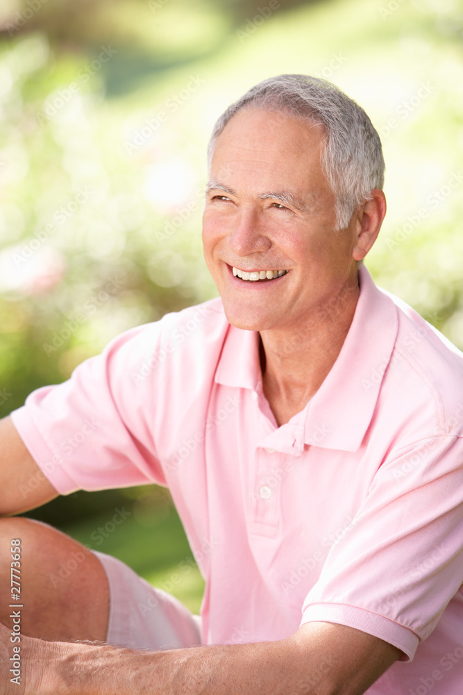 Senior man relaxing in a park Senior man relaxing in a park