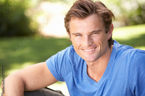 Portrait Of Young Man Relaxing In Park