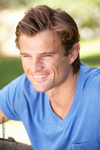Portrait Of Young Man Relaxing In Park