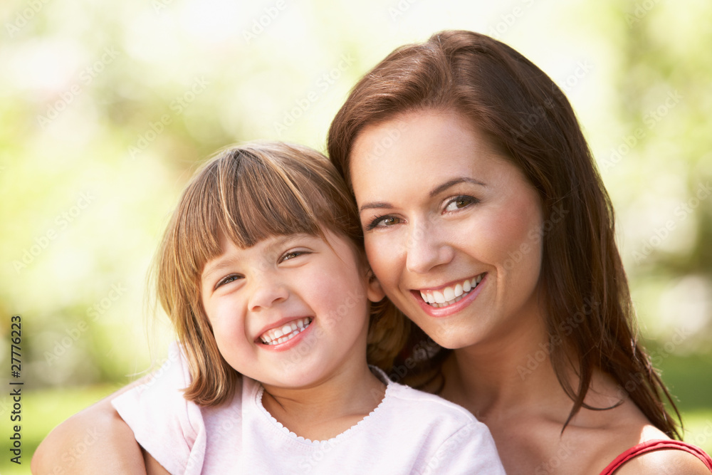 Portrait Of Mother And Child Relaxing In Park Portrait Of Mother And Child Relaxing In Park