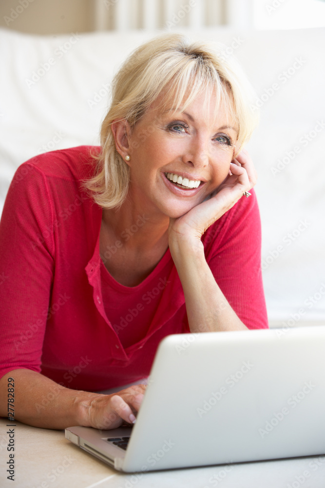 Middle age woman on her laptop computer Middle age woman on her laptop computer