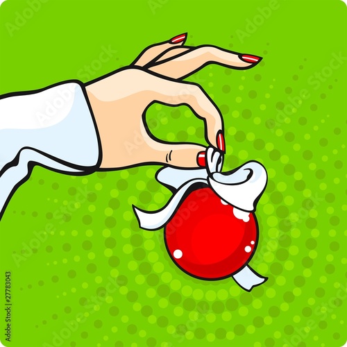 Hand with a christmas-tree decoration