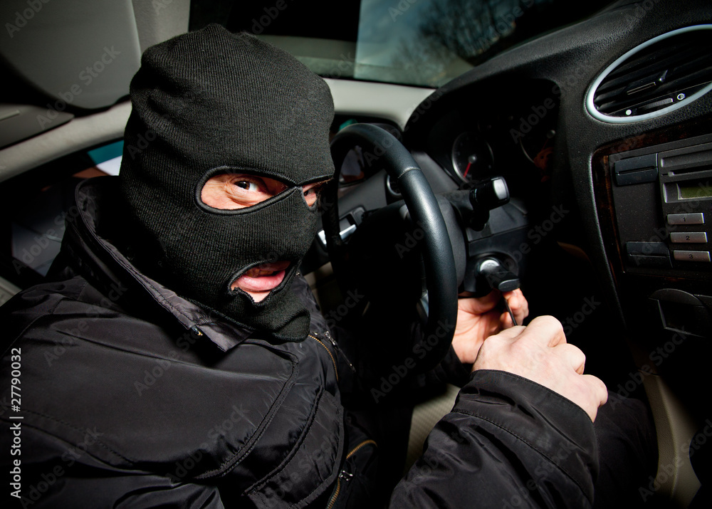 robber and the thief in a mask hijacks the car robber and the thief in a mask hijacks the car