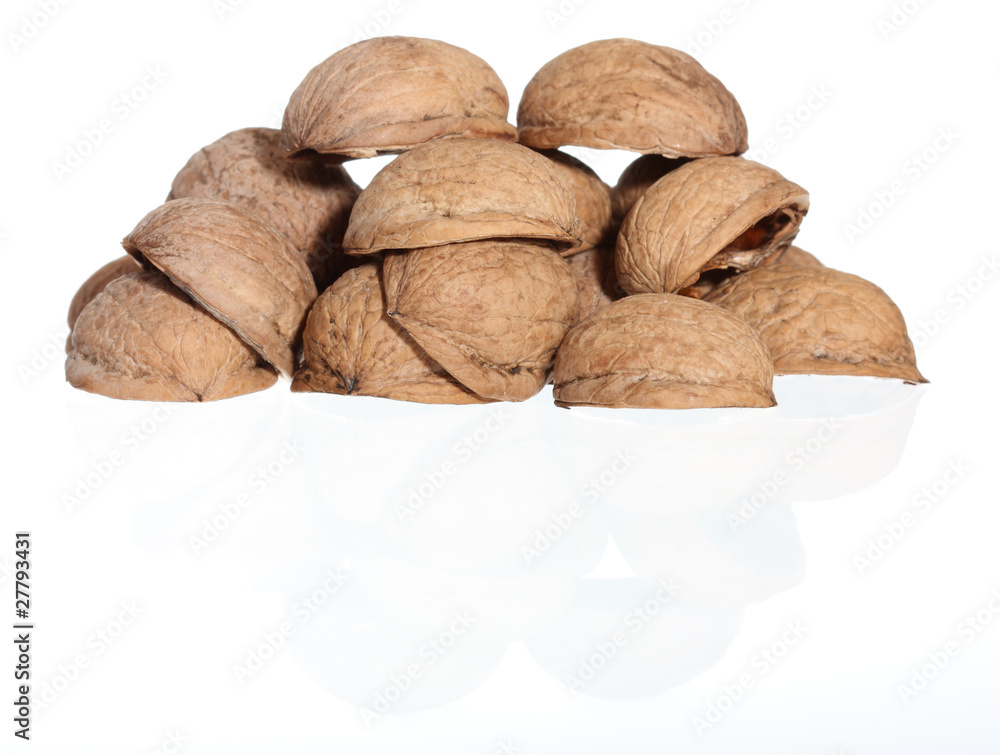 Hill of walnut's nutshells on white background Hill of walnut's nutshells on white background