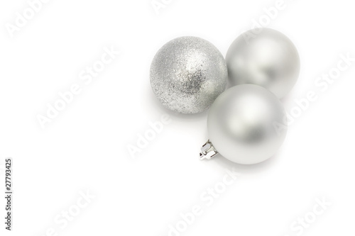 Christmas baubles  three silvery balls on white background