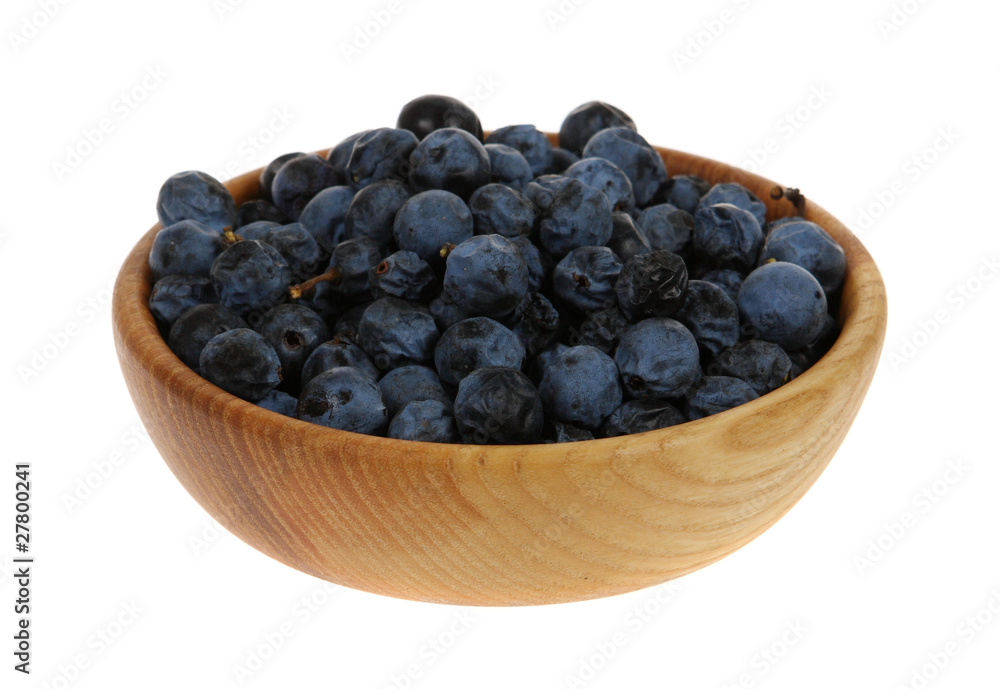sloe, blackthorn in a wooden mortar (Prunus spinosa) sloe, blackthorn in a wooden mortar (Prunus spinosa)
