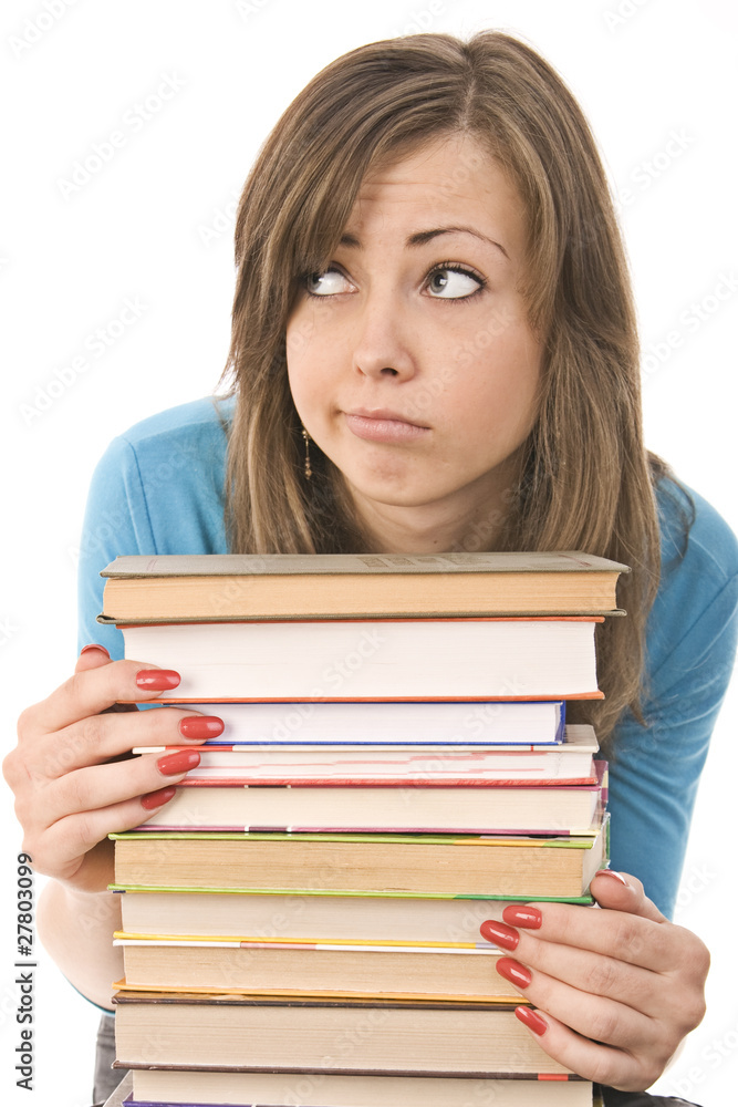 beautiful girl thoughtfully reading a book, surrounded by books beautiful girl thoughtfully reading a book, surrounded by books