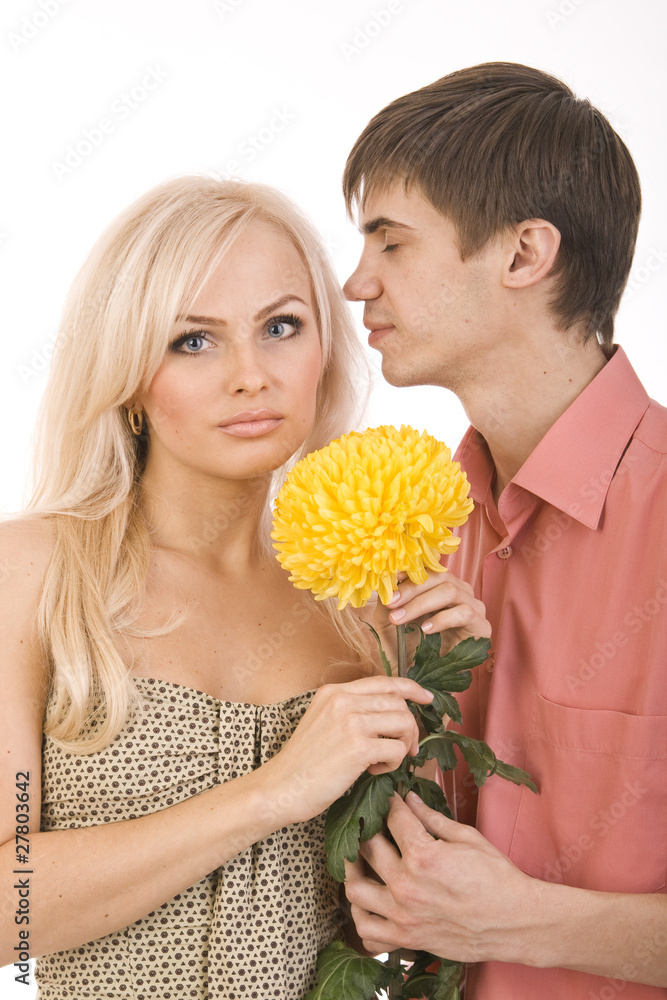 beautiful couple. guy gives sexy girls big flower beautiful couple. guy gives sexy girls big flower
