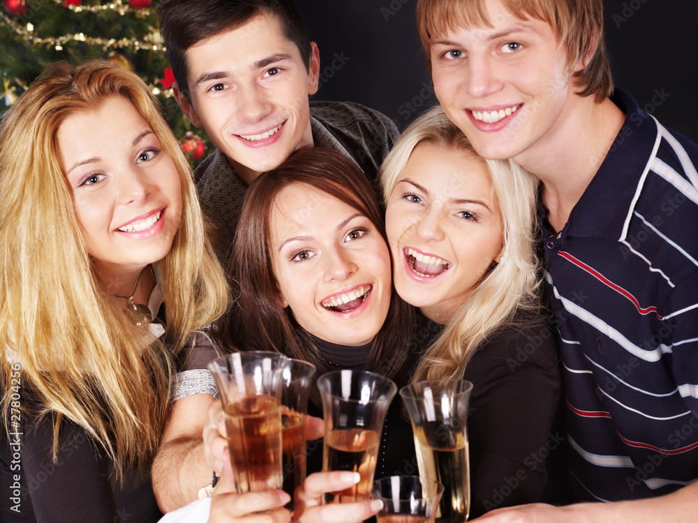 Group young people at nightclub by christmas tree. Group young people at nightclub by christmas tree.