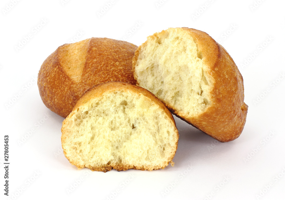 Two bread rolls with one broken in half Two bread rolls with one broken in half