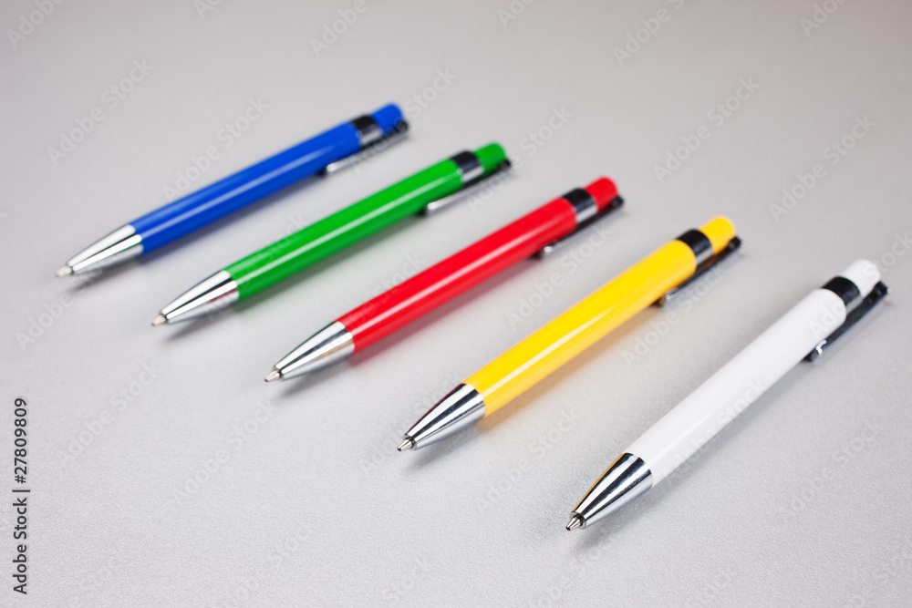 Set of  pens on table