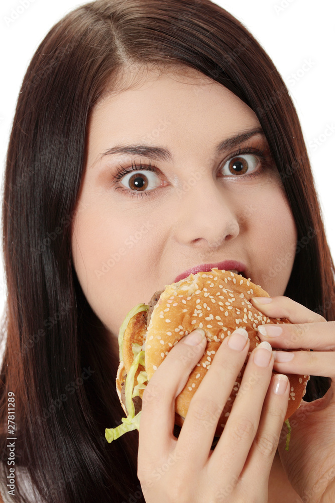 Woman eating hamburger