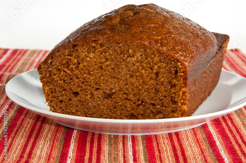 Loaf of freshly baked pumkin bread on holiday napkin
