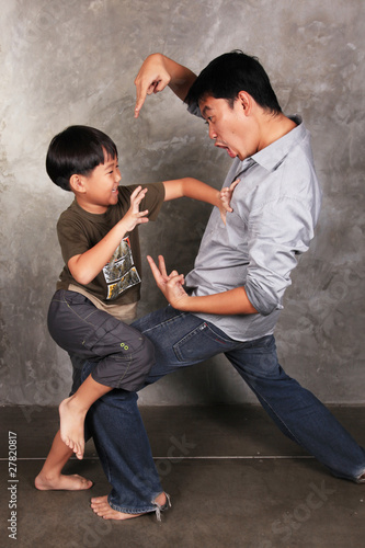 Funny fighting , A grandchild act fighting with his uncle.