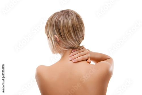 Woman massaging pain back isolated on white