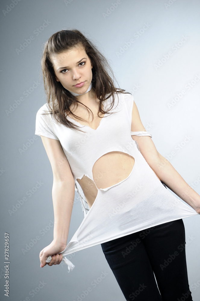 Obraz premium beautiful model posing with torn shirt