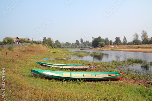 small boats on coast river