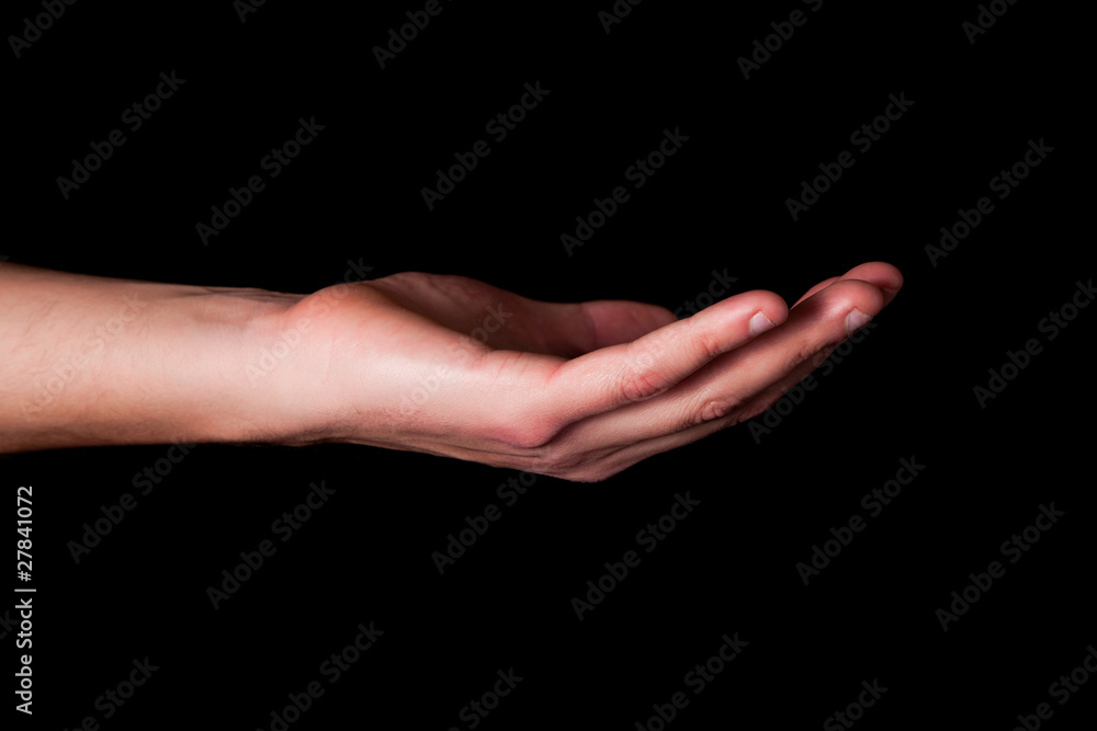 Male hand on black background
