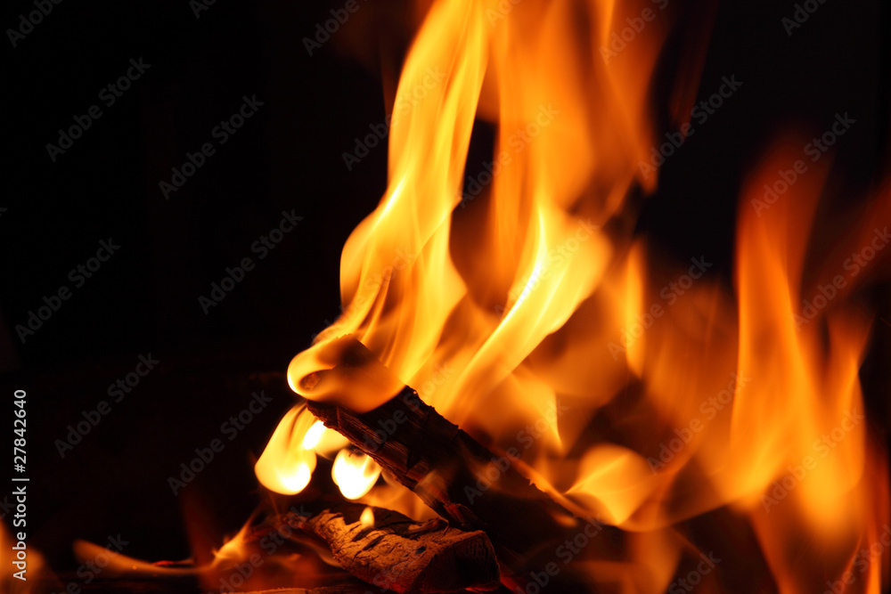 Close-up of fire and flames on a black background Close-up of fire and flames on a black background
