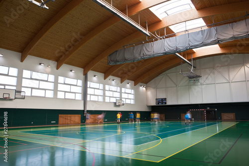 interior of a modern multifunctional gymnasium with young people photo