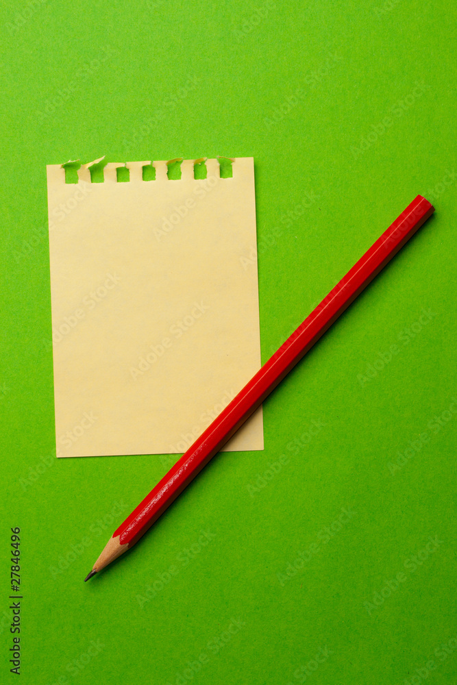 Sheet and pencil isolated on green Sheet and pencil isolated on green