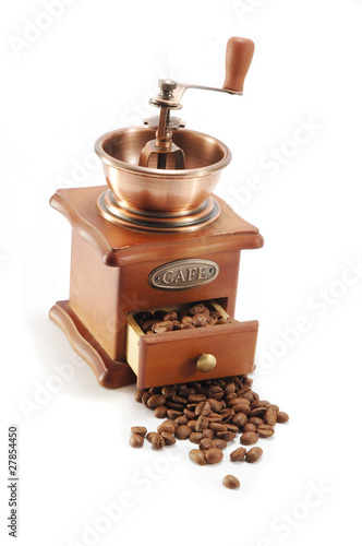 Old coffee grinder on white background