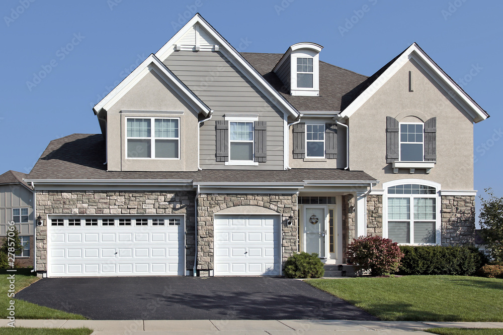 Home with three car stone garage