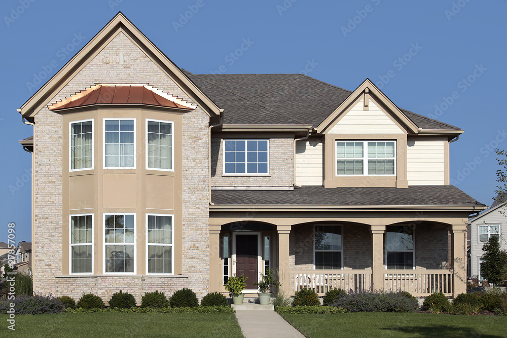 Tan home with front porch