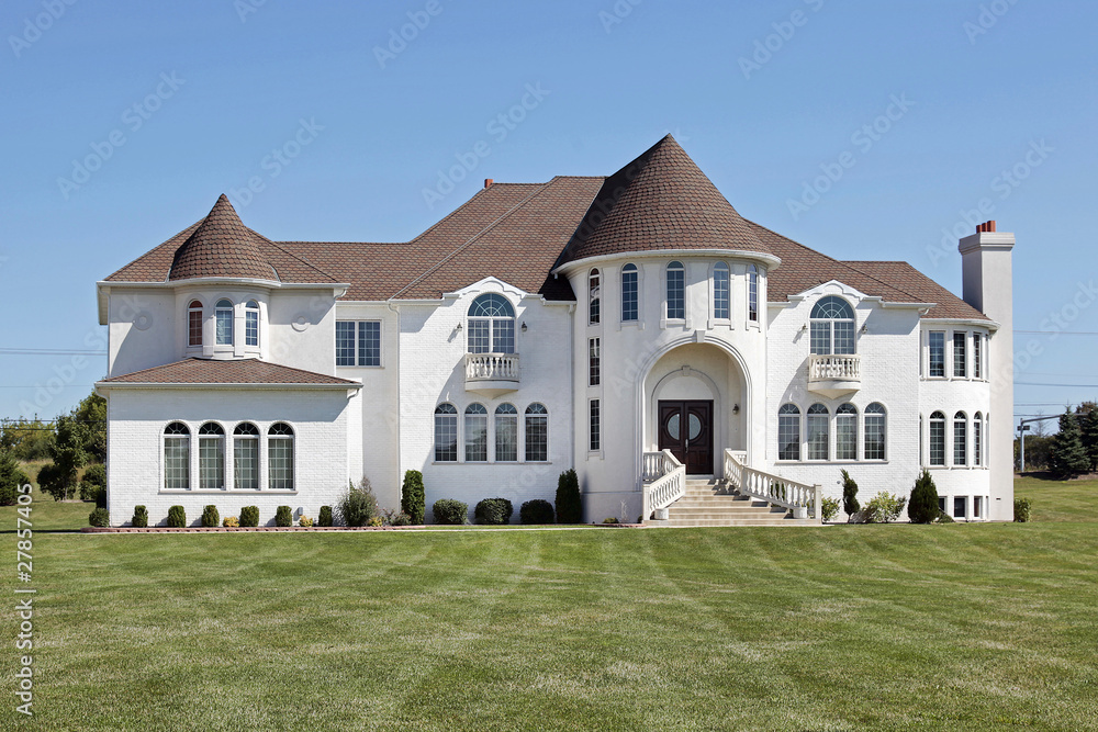 Luxury white home with front turret Luxury white home with front turret