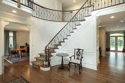 Foyer with curved staircase photo